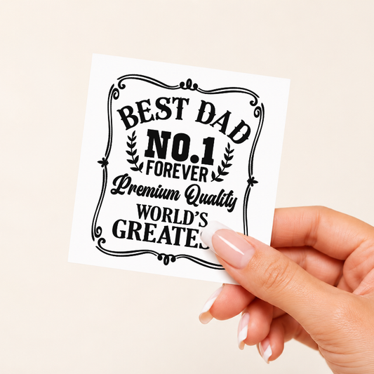 Hand holding a card with 'Best Dad No. 1 Forever Premium Quality World's Greatest' text on a beige background
