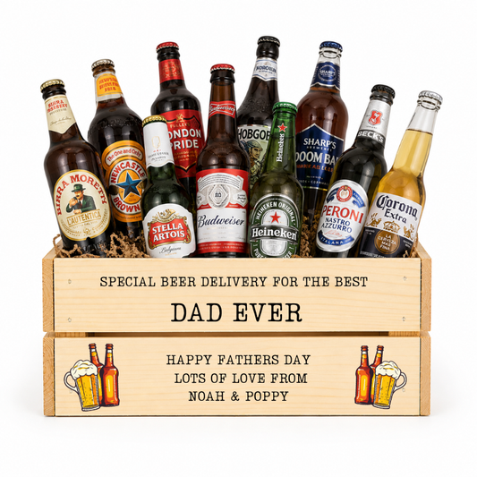 Assorted beer bottles in a wooden crate with personalized message on a white background